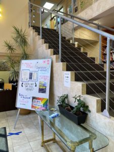 The interior, showing a staircase and a board.