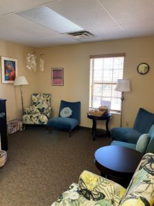 The cozy interior, showing many comfy-looking colorful and carpeted floors.